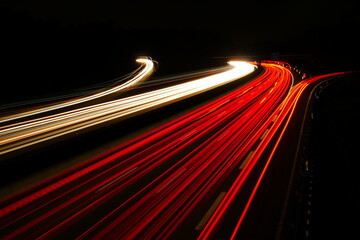highway at night with exits and bridge