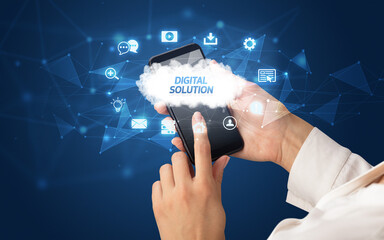 Female hand holding smartphone with DIGITAL SOLUTION inscription, cloud technology concept