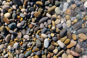 clear sea water on a rocky beach. selective focus
