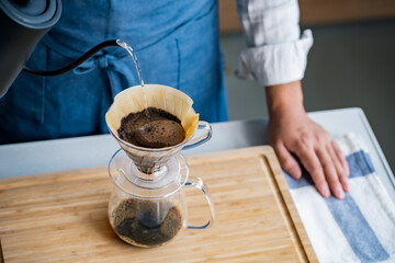 Man making coffee in the kitchen.
Delicious coffee image.