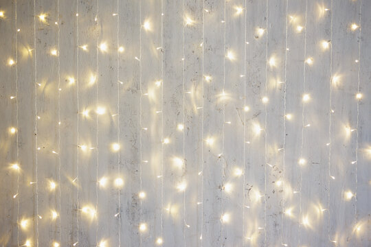 Christmas background - garland lights on wall