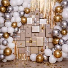 Wall decoration in golden and silver color with gifts and air balloons