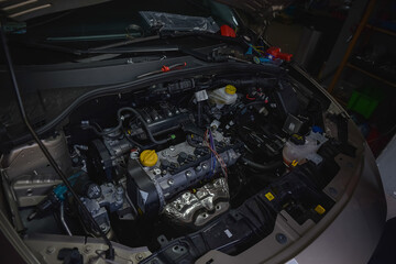 Legionowo, Poland - May 07, 2020: Car mechanic installing a gas