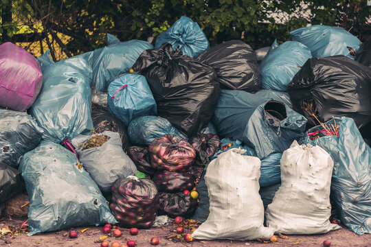 Closeup shot of a pile of trash bags - pollution concept