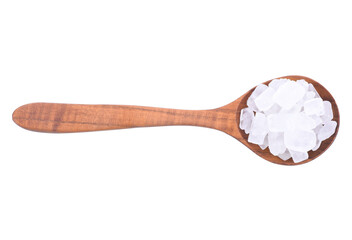 Rock sugar with wooden scoop on wood background.