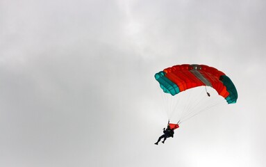A gliding parachutist in a cloudy weather.