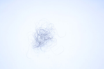 Hair fall on the ground. Loss of hair after combing. Pubic hair fall on room floor. losing hair on white floor 
