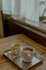 Hot coffee and tea on wooden table in cafe. Place for text. Banner Concept.