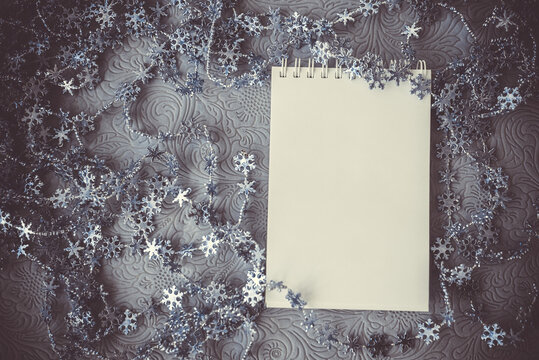 Merry christmas and happy holidays vintage toned greeting card, frame, banner new year. Open notepad, cop space, flat lay.