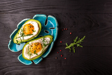 avocado baked with egg, Delicious breakfast or snack, banner, catering menu recipe place for text, top view
