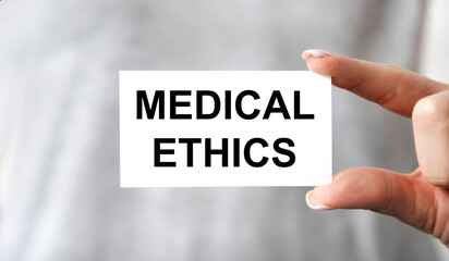 Medical Ethics card in hands of Medical Doctor