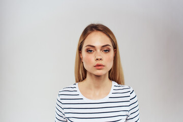 cute blonde girl in striped t shirt lifestyle studio