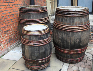 three old wooden wine barrels