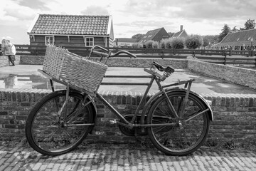 Fototapeta na wymiar Old Dutch bicycle with basket means of transport in the villages