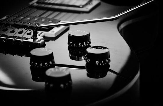 Close-up of an electric guitar isolated on black background