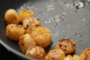 frying scallops on non stock pan closeup