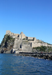 Fototapeta na wymiar Aragonese Castle on a sunny day on Ischia Island of Napoli, Italy 