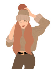 Beautiful portrait of a woman in winter. Smiling girl wearing warm clothes having fun. She is wearing hat and sweater isolated on white wall