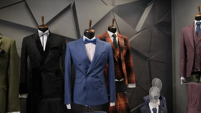 Luxury men fashion suits displaying on mannequins at store