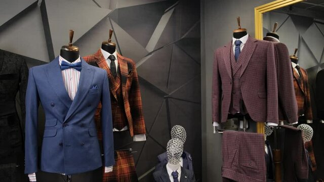 Luxury men fashion suits displaying on mannequins at store