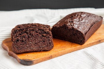 Fototapeta na wymiar Homemade Chocolate Zucchini Bread on a rustic wooden board, side view. Close-up.