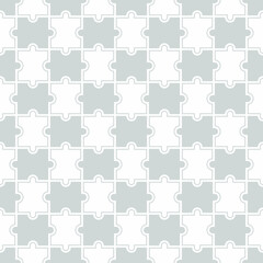 Obraz premium Seamless background from blank puzzle pieces. Grid with monochrome geometric design. Mosaic from puzzle pieces. Vector illustration