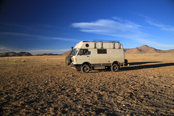 Fototapeta na wymiar 4x4 Offroad Camper Van at desert landscape in Bolivia