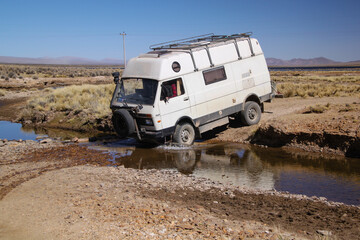 4x4 Offroad Camper Van crossing creek in Bolivia © Christina Lutz