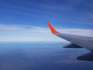 Fototapeta premium Wing aircraft in the blue sky