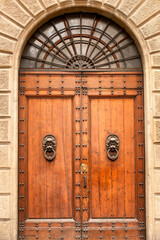 Beautiful large timber door on the exterior of building in the centre of Florence