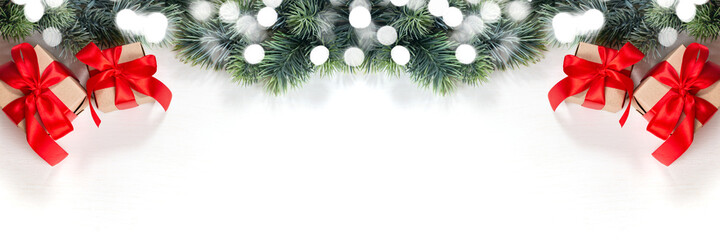 Fototapeta na wymiar Christmas gifts, fir branch on a white background. Merry Christmas and Happy Holidays postcard, frame. Winter Christmas holiday theme. Flat lay, top view.