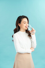 young woman drinks clean water adheres to drinking regime.