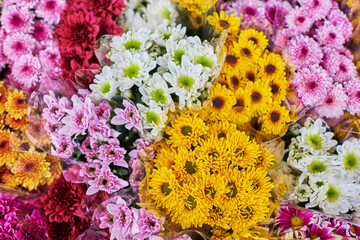 Beautiful bouquets of mixed flowers in a flower shop. A bright mix of flowers. Background on full screen. Handsome fresh bouquets. Flowers delivery. Floral shop concept . Selective focus.