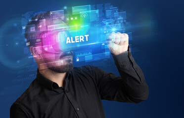 Businessman looking through Virtual Reality glasses with ALERT inscription, innovative security concept