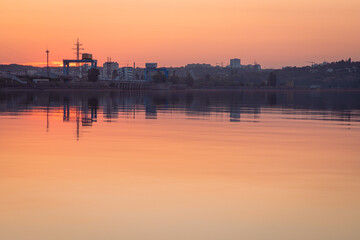 Fototapeta premium Sunset on the Kiev Sea with the view on the Kiev hydroelectric power station, Ukraine