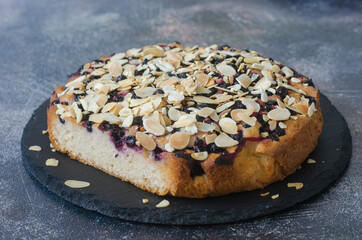 Pie with black currant and almond petals