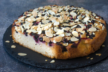 Pie with black currant and almond petals
