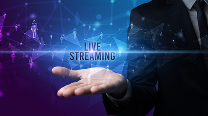 Elegant hand holding LIVE STREAMING inscription, social networking concept