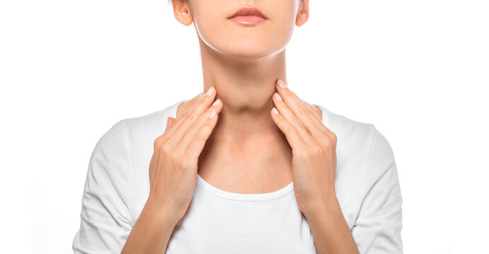 Woman palpation her neck, examine thyroid gland. Enlarged butterfly-shaped thyroid gland, isolated on white background