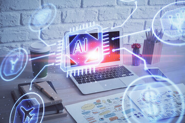 Double exposure of desktop computer and technology theme hologram. Concept of software development.