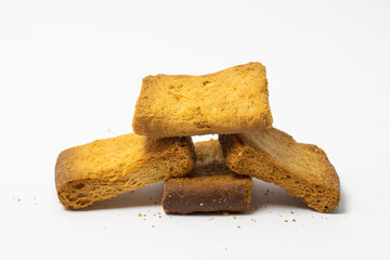 A pile of traditional dry toast biscuit or bread isolated on white background