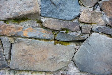 Castle wall made of old stones textures for design and photo background.