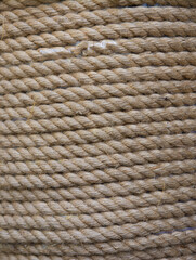 Light yellow rope wound in a skein.