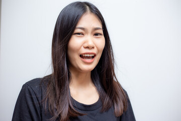 Young beautiful asian female posing with black t-shirt.