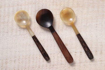 spoon made with buffalo horn on a wooden base