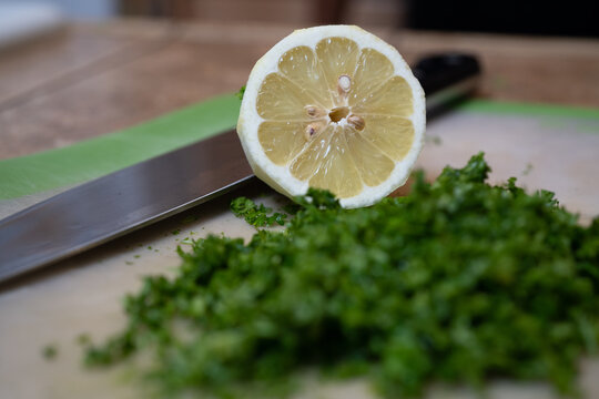 Selective focus shot of sliced lime and koreander on a table