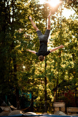 man skillfully jumps and performs trick upside down in the air