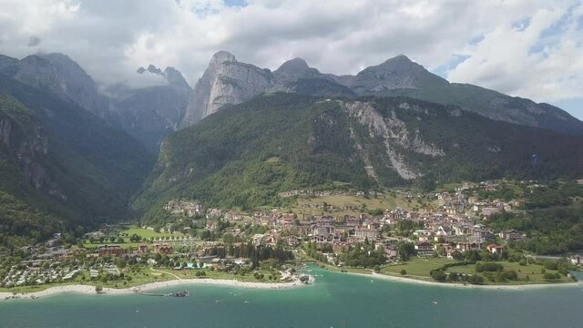Aerial of a Italian village on the Molveno lake surrounded by the Mountains Dolomite Italy, Europe