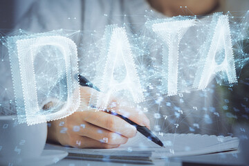 Multi exposure of writing hands on background with data solution hologram. Technology concept.