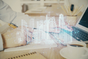 High tech city drawing with businessman working on computer on background. Smartcity concept. Double exposure.